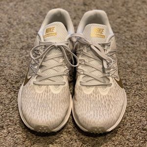 Women’s Nike Winflo 5 metallic gold running shoes